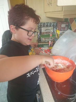Oisin making Kinder Blondies