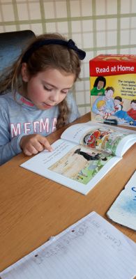 Caoimhe enjoying reading time at home